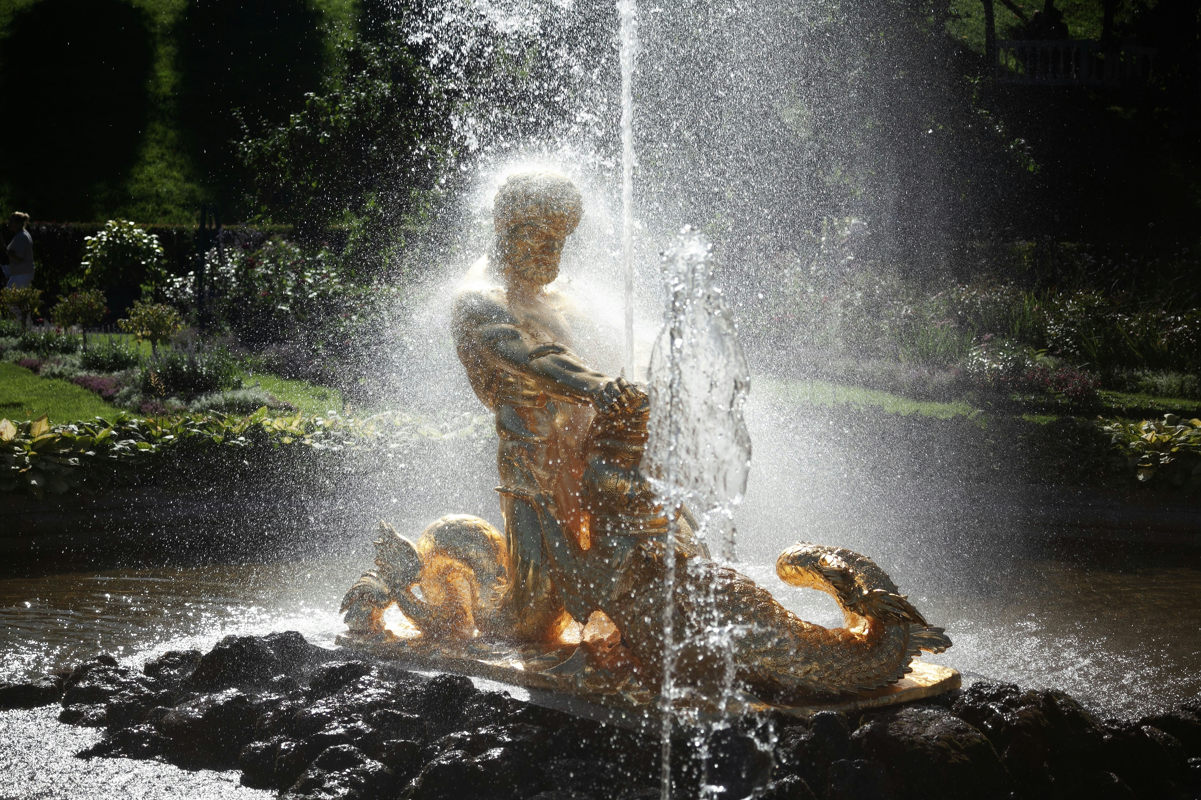 A statue sprays water in a beautiful fountain. photo – Free Man Image ...