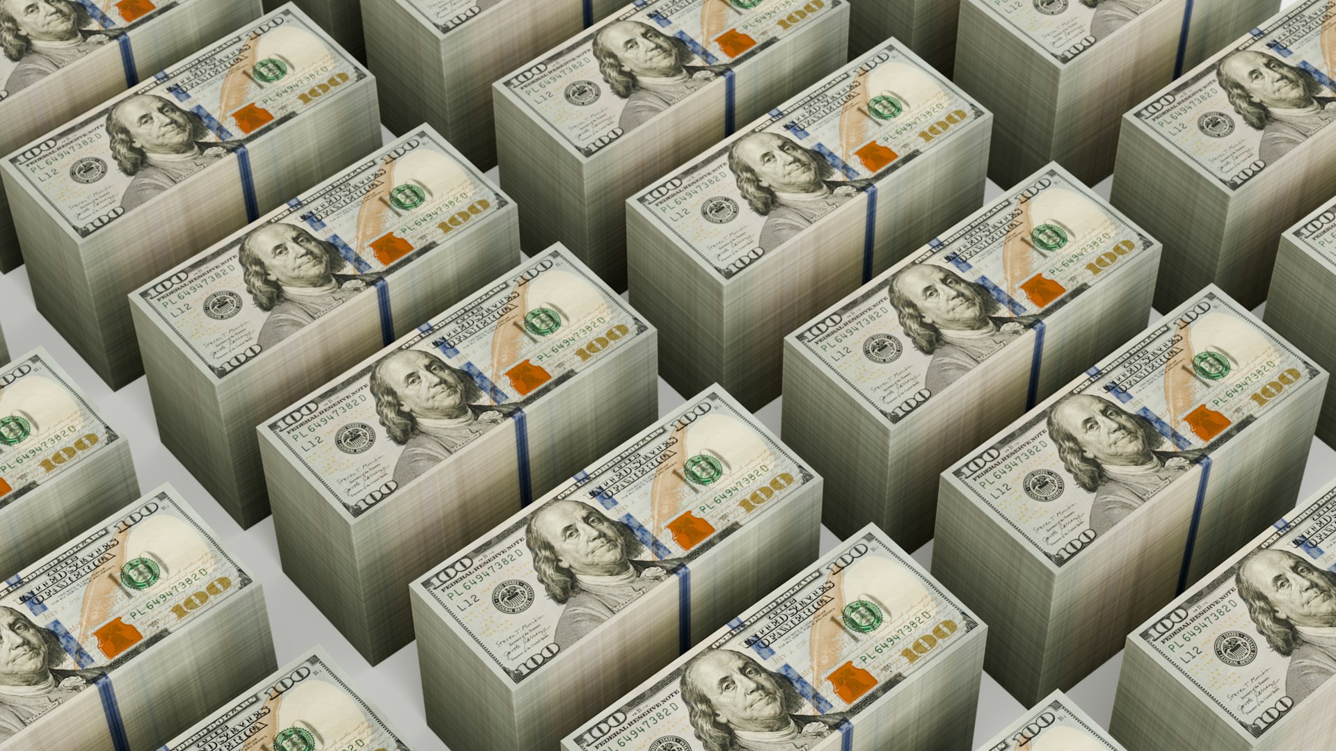 Stacks of $100 bills are neatly arranged.