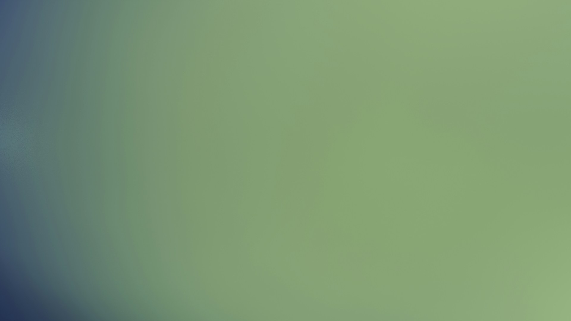 The image shows a blurry, greenish-blue gradient.