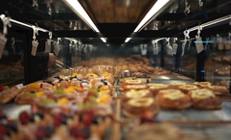 Pastries are displayed beautifully in a bakery.