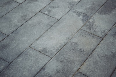 Grey pavement bricks arranged diagonally.