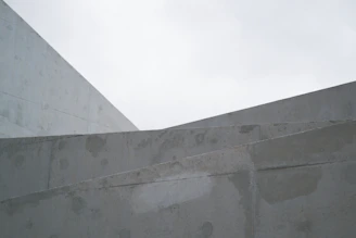 Abstract geometric shapes against a cloudy sky