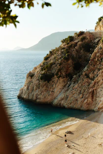 Beautiful turquoise waters meet the sandy beach.
