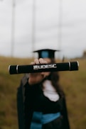 Graduation day: a diploma held up proudly.
