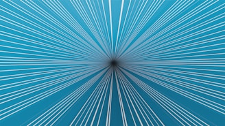 Lines converge on a dark point, creating an illusion.