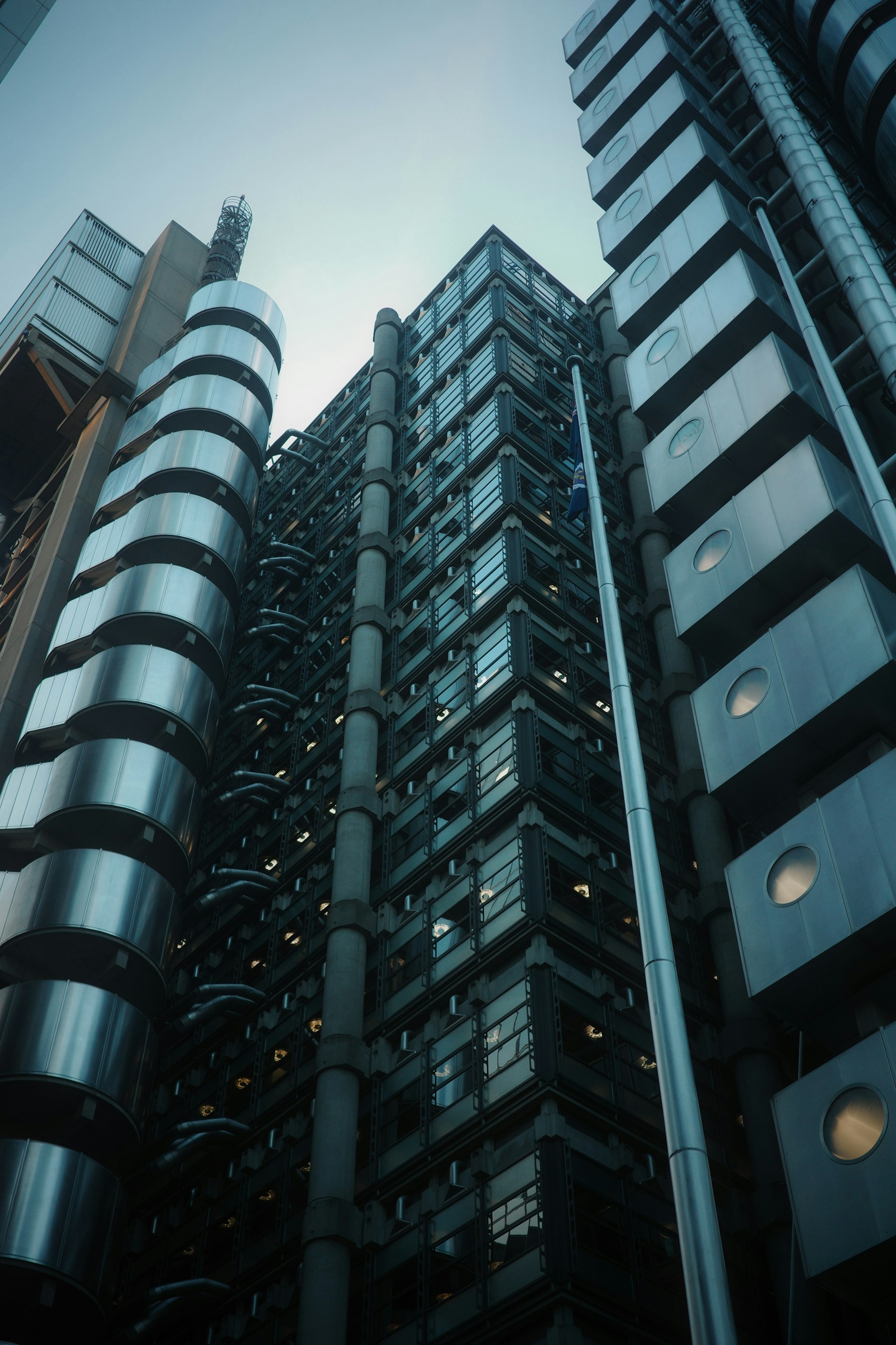 A modern, futuristic building reaches towards the sky.