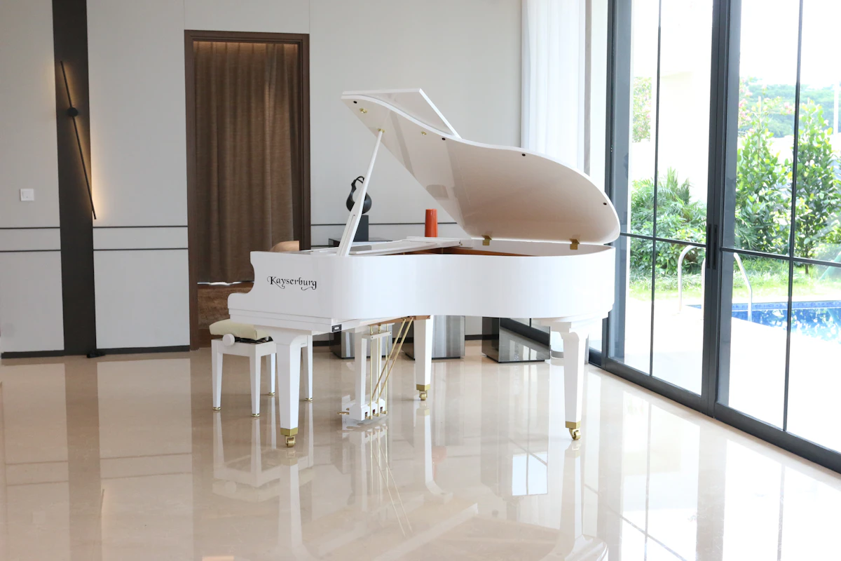 White grand piano in a bright interior for event rental style reference