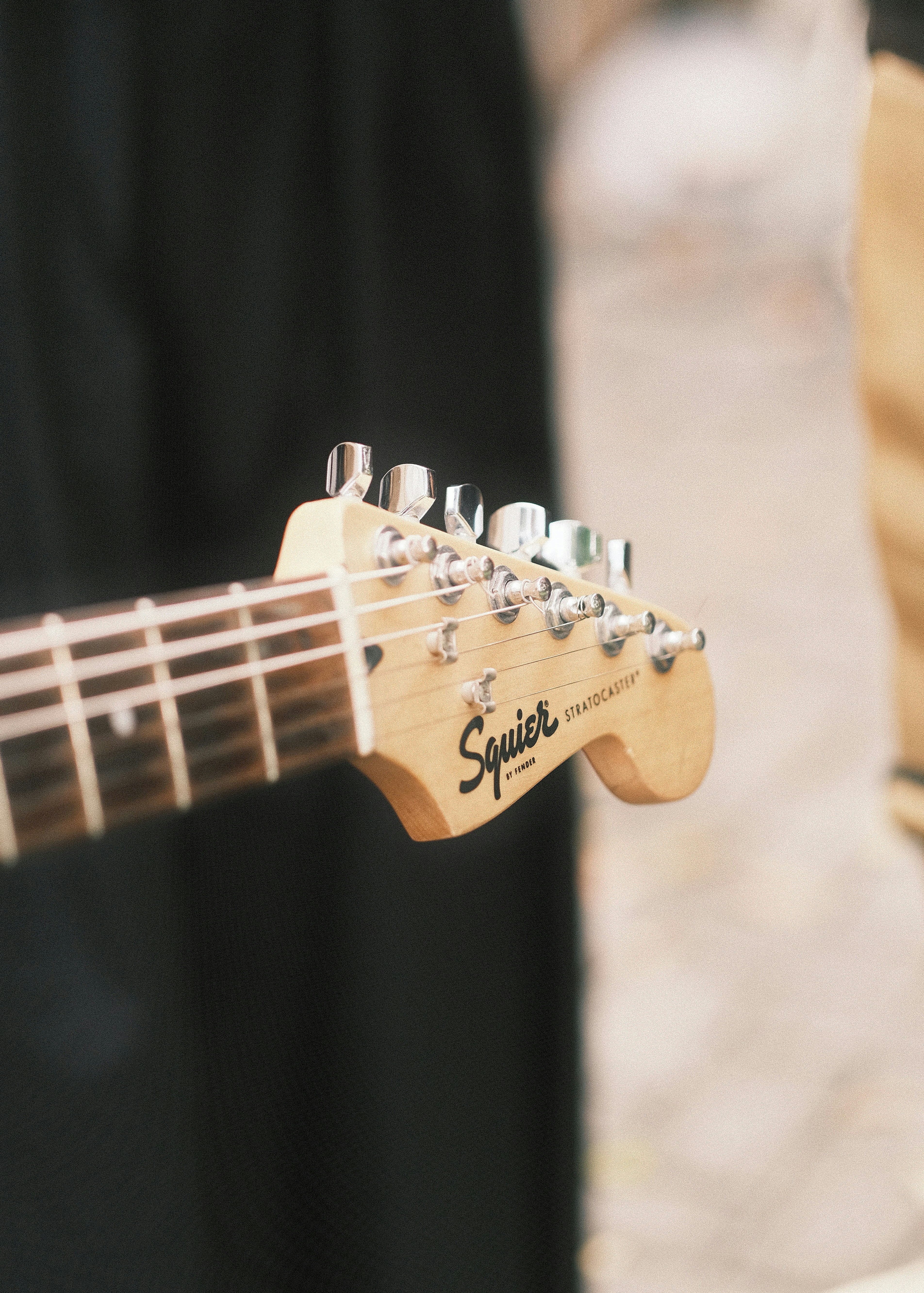 A squier stratocaster guitar headstock.