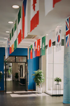 Flags of many nations hang inside the building