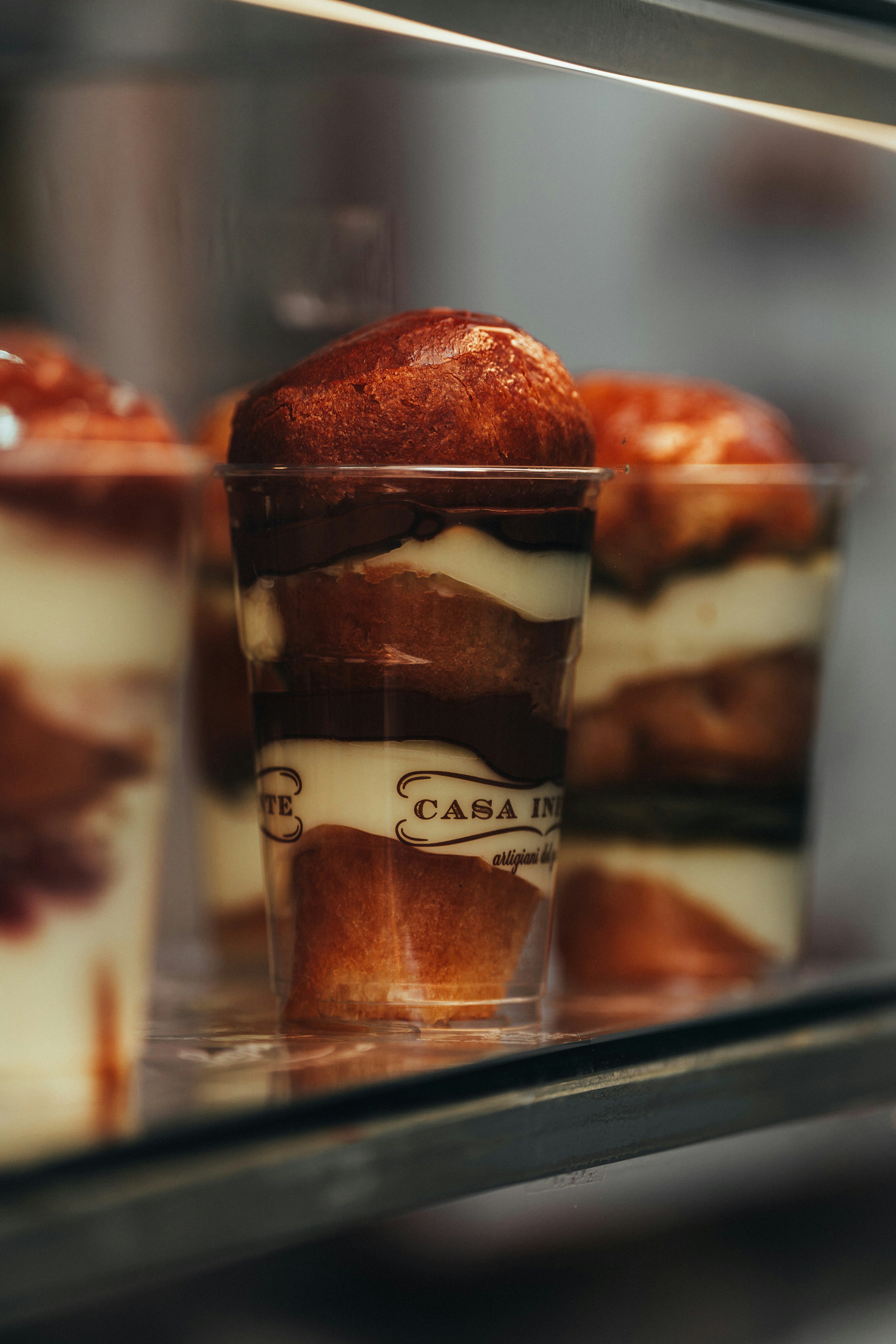 Delicious layered desserts sit in a display case. photo – Free Food ...