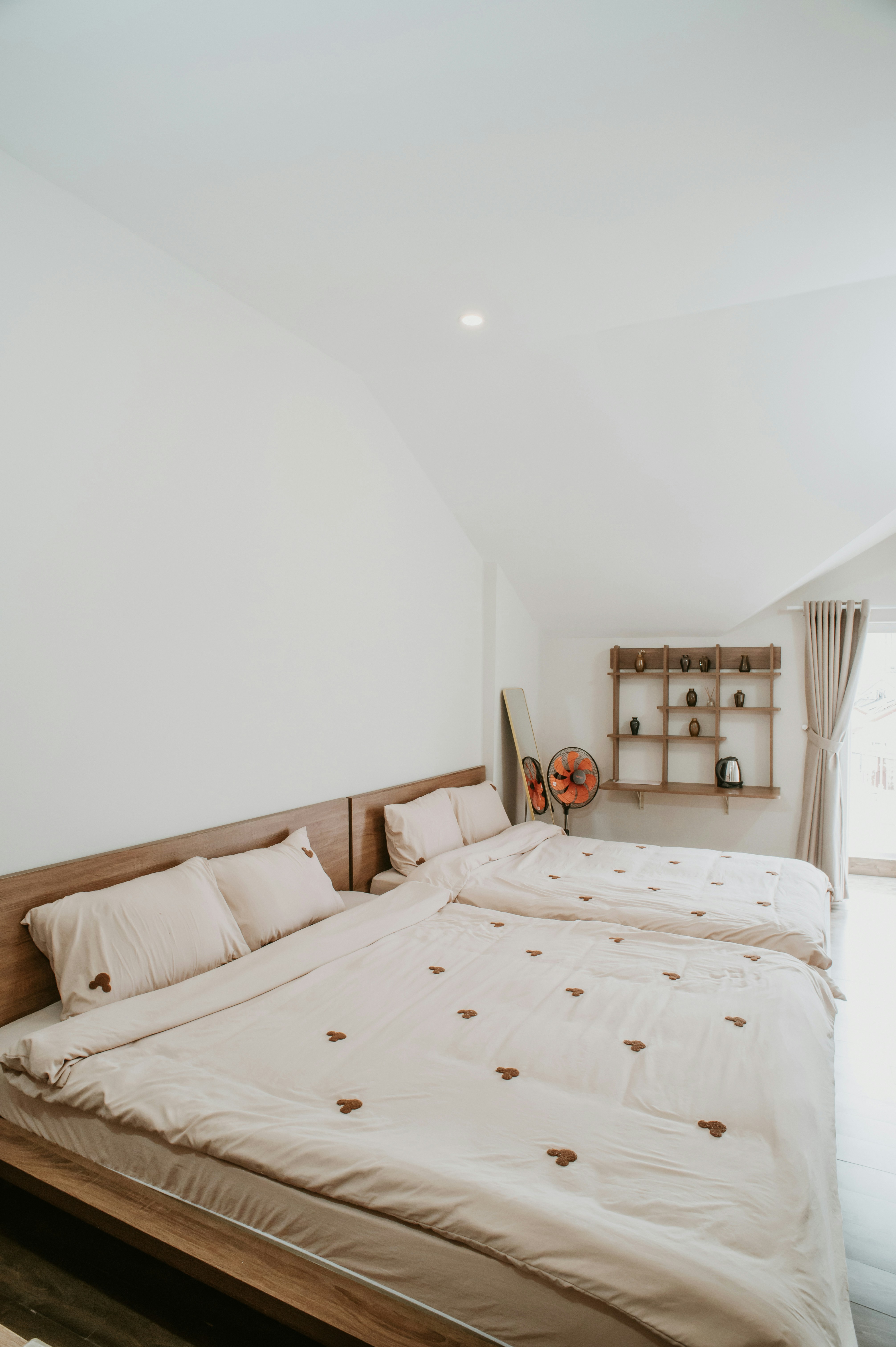 A bright and cozy bedroom with two beds.
