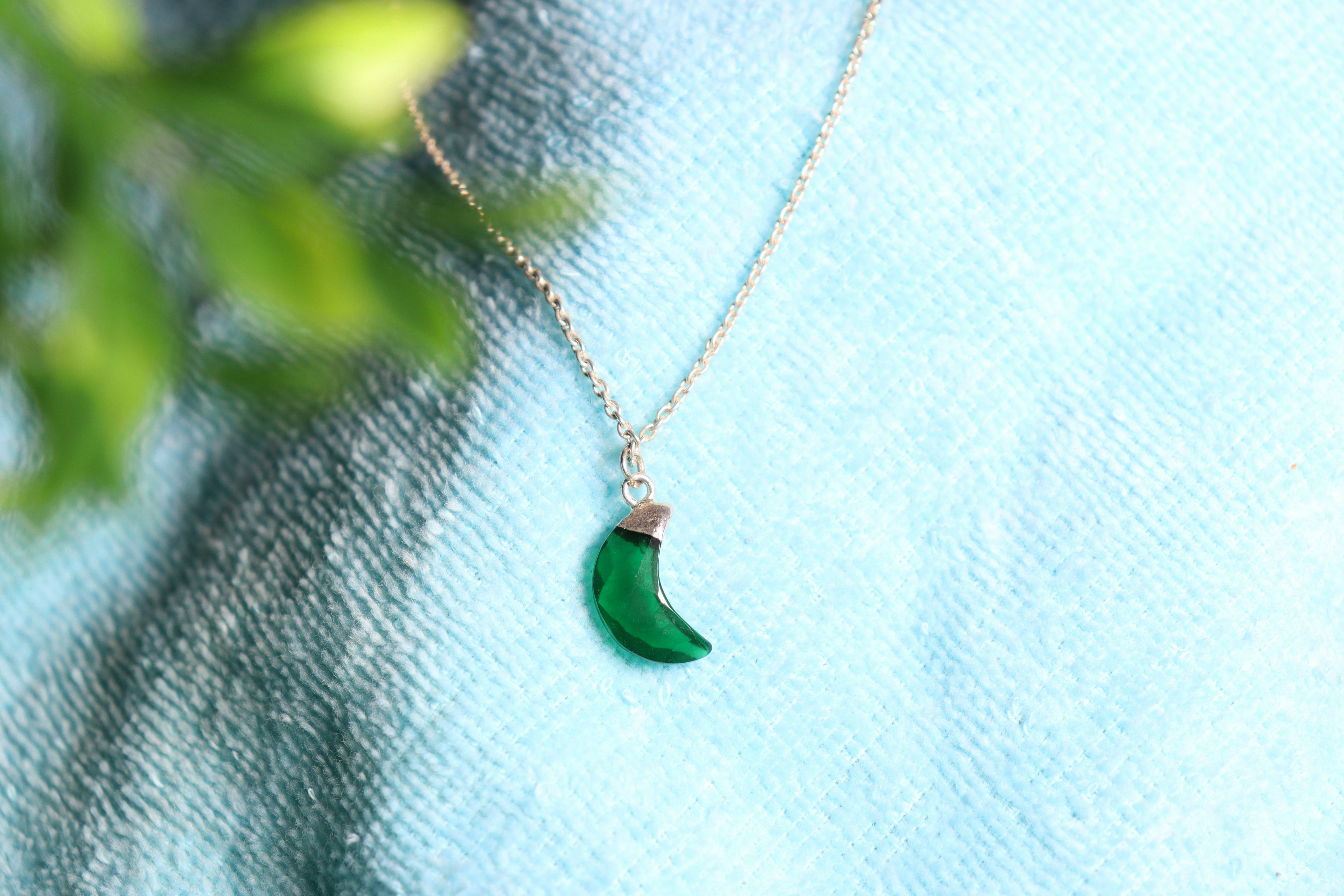 A stunning emerald pendant on a chain