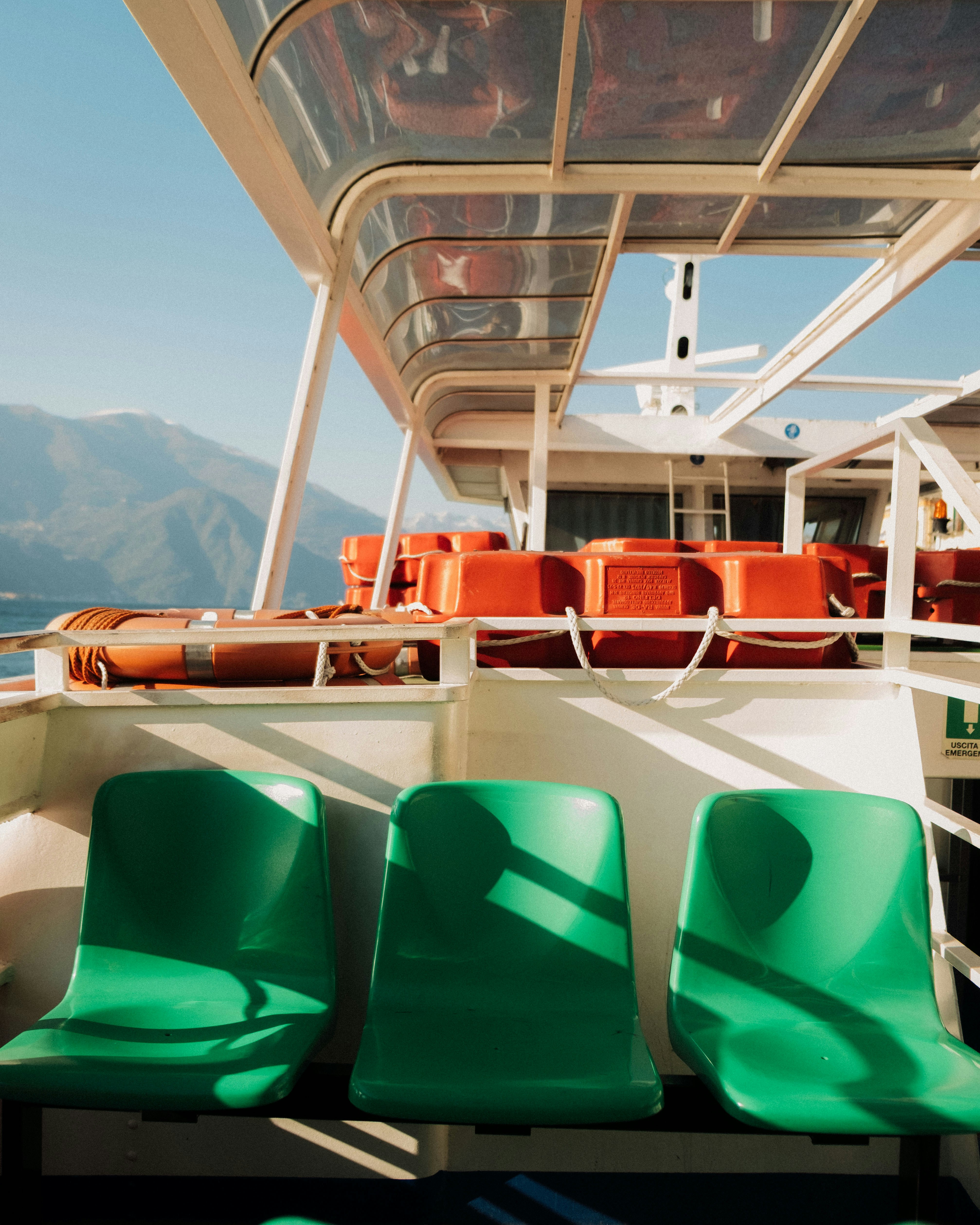 On a boat with seats and life preservers