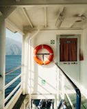 A life ring hangs on a ship's interior wall.