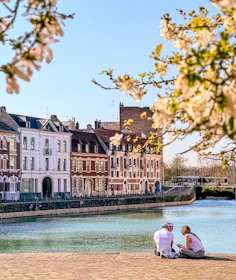 People enjoy the scenic view by the water.