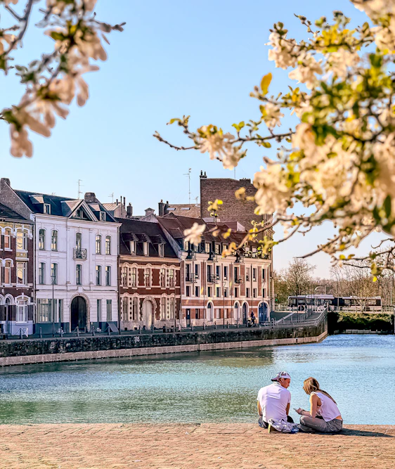 People enjoy the scenic view by the water.