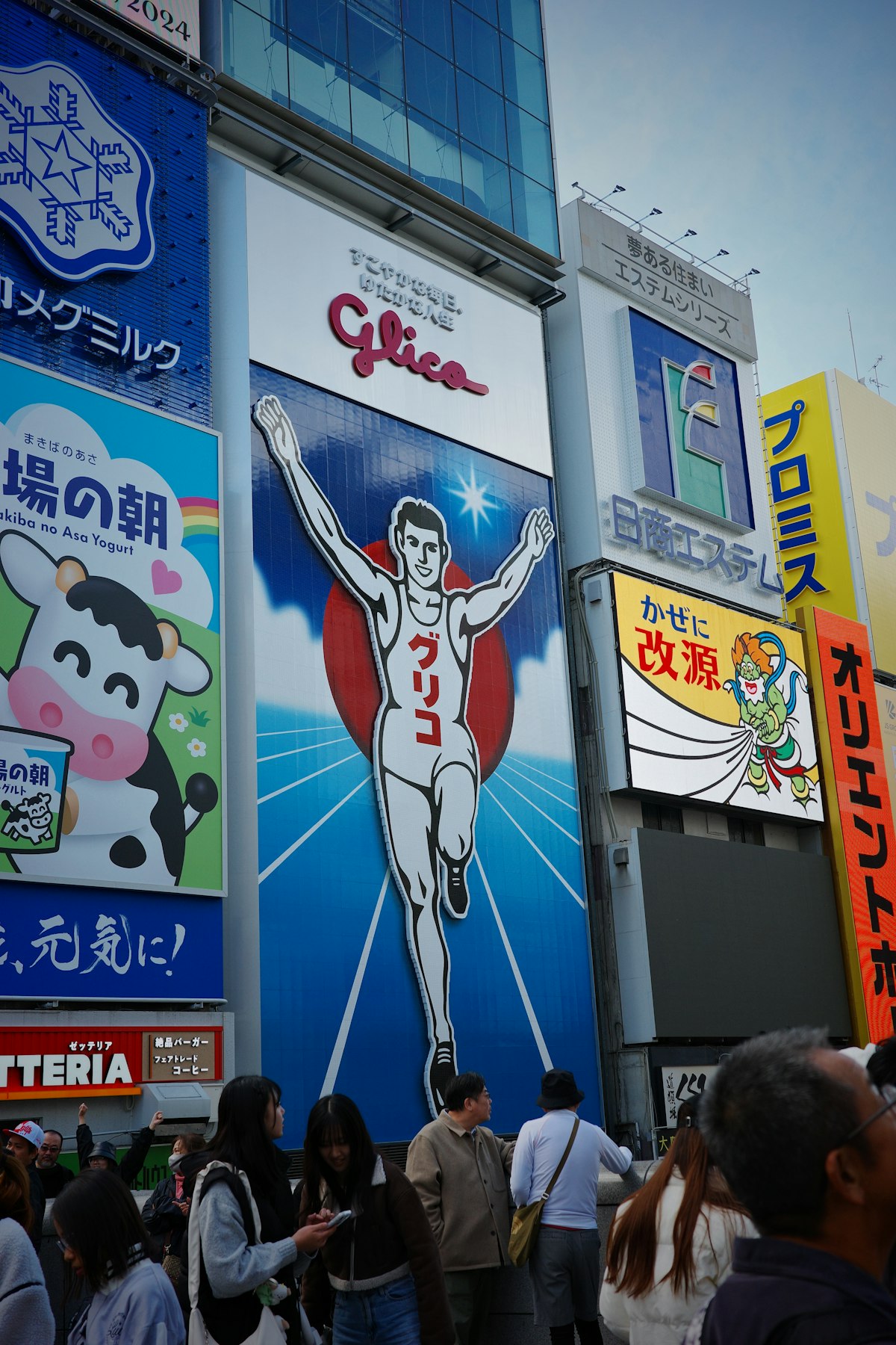 Osaka April — the iconic Glico Running Man neon advertisement illuminated in Dotonbori at night