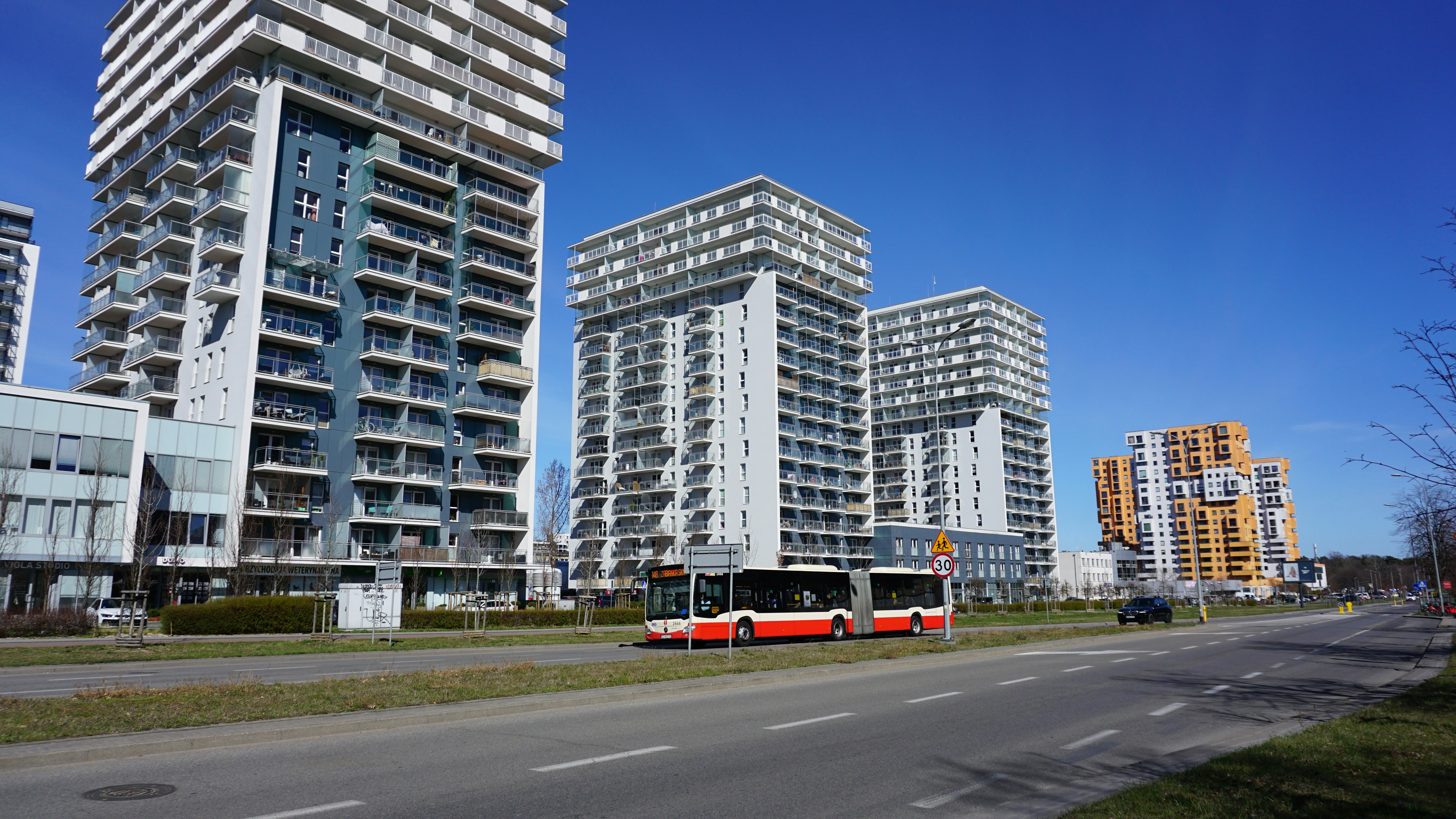 Modern high-rise buildings with a bus on a road. photo – Free Bus Image ...