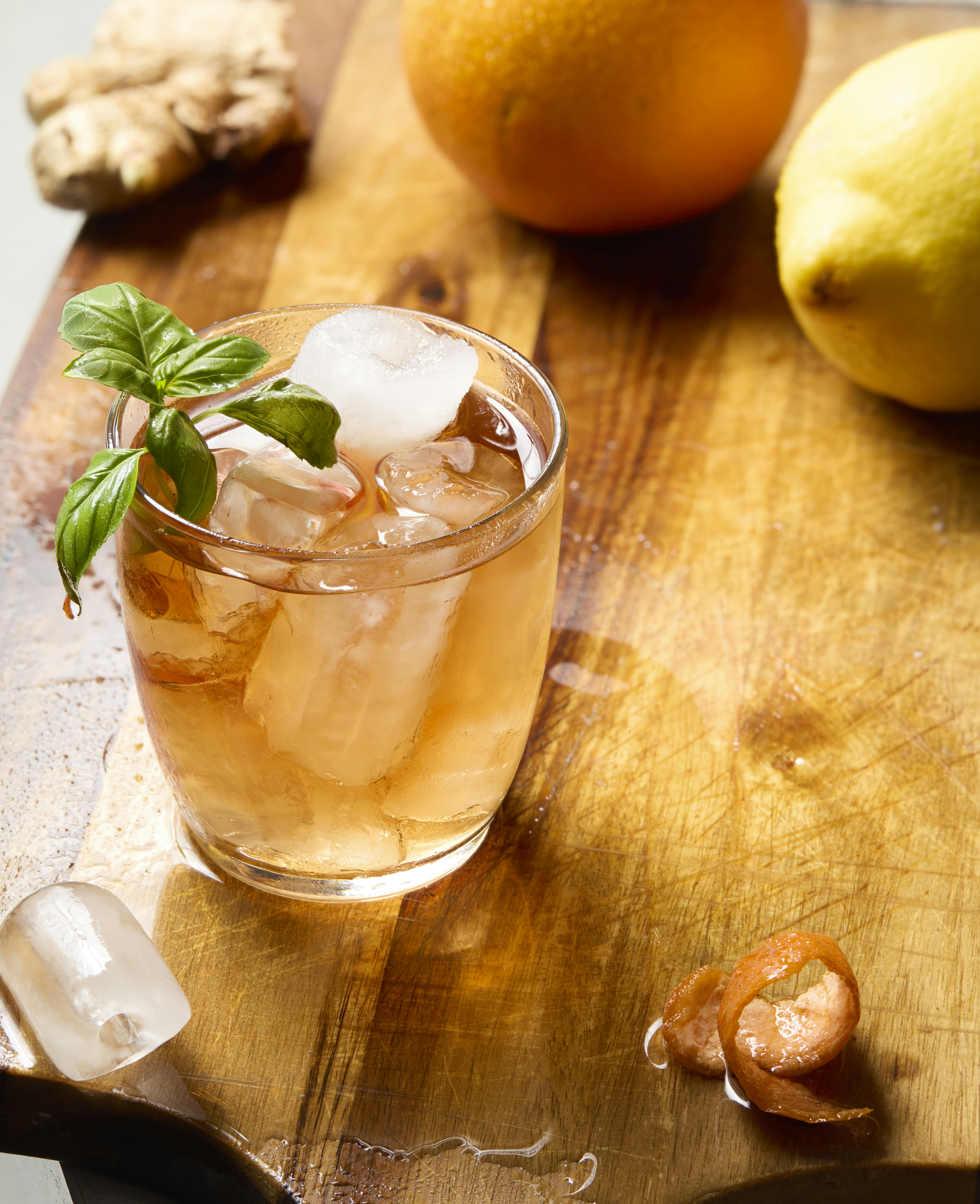 A refreshing cocktail with citrus and basil.