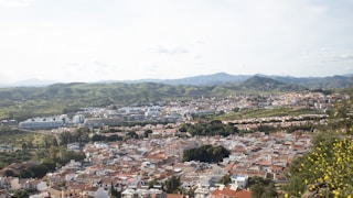A bird's-eye view of a city and hills.