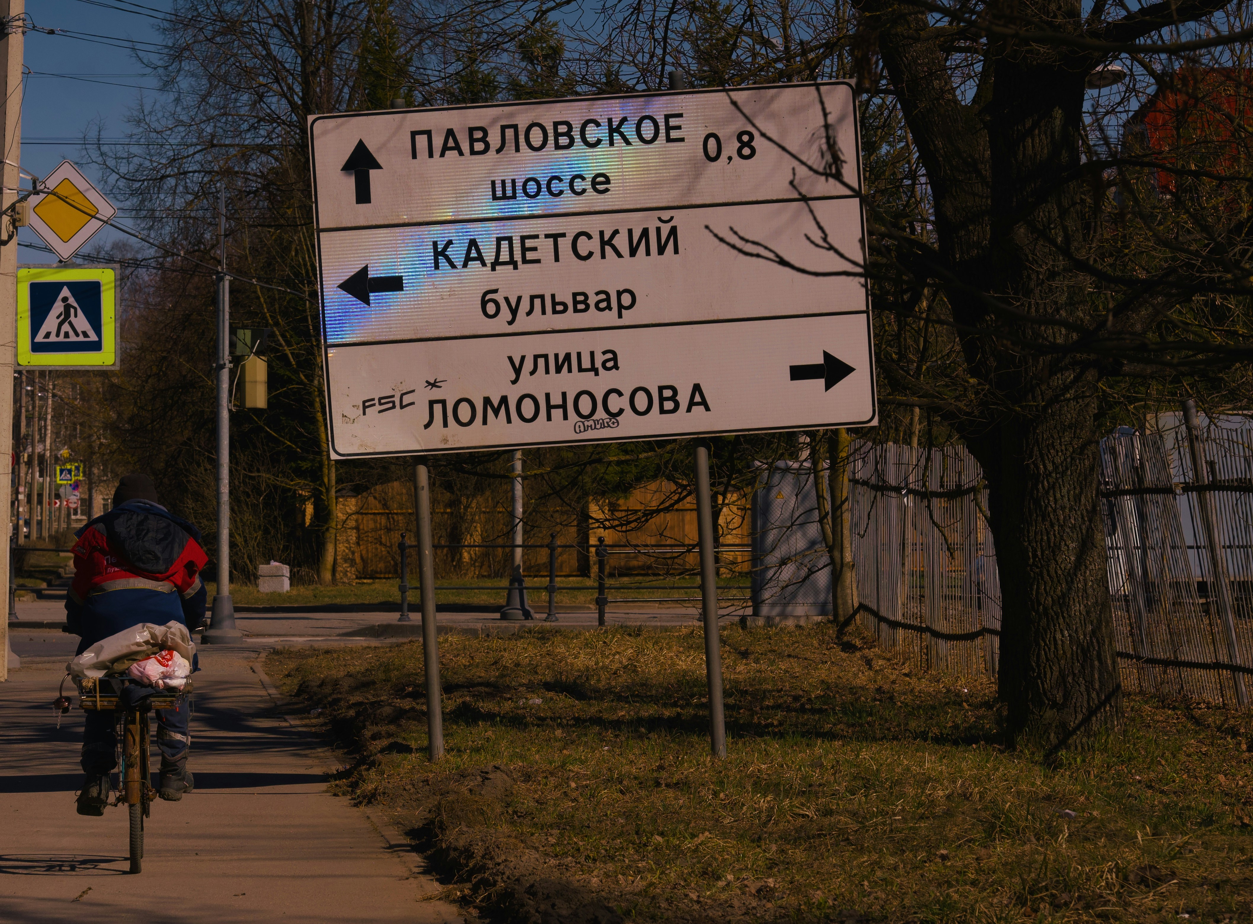Road sign directs traffic to different locations.