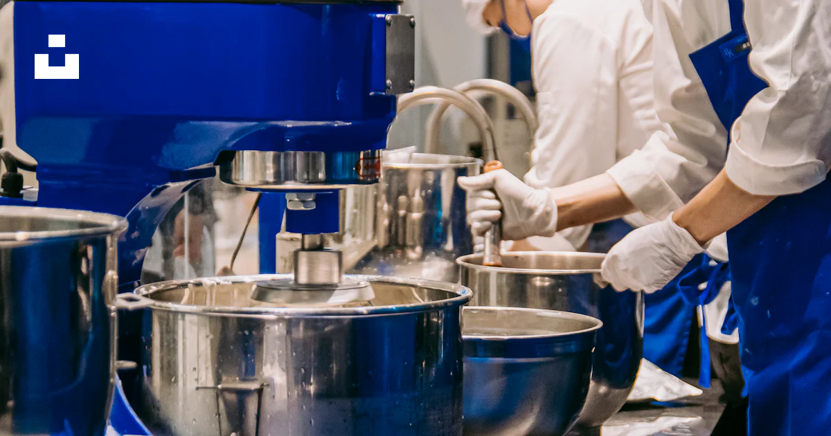 Chefs work in a kitchen, using mixers and bowls. photo – Free Food ...