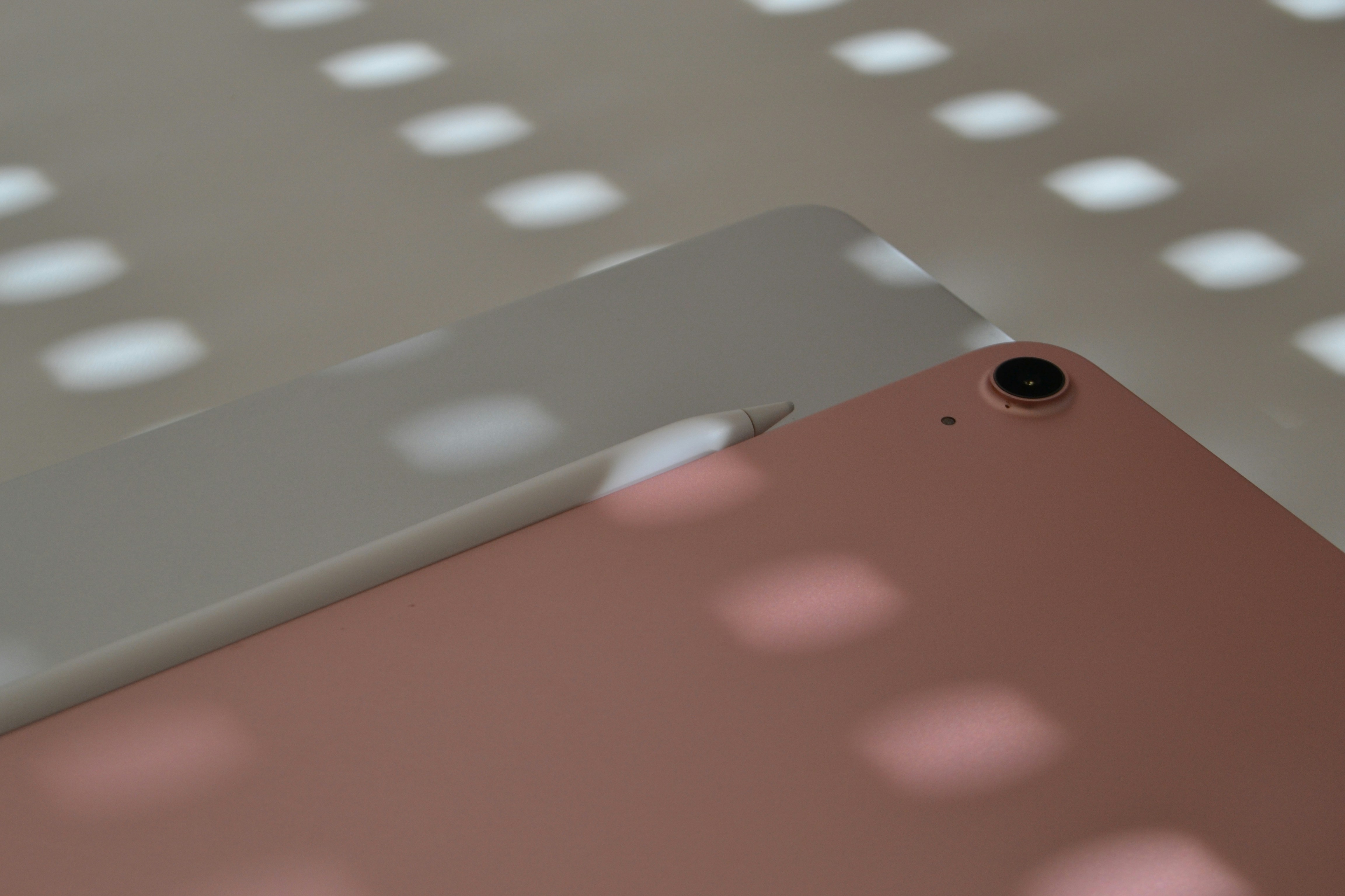 An ipad's back and a shadow of light.