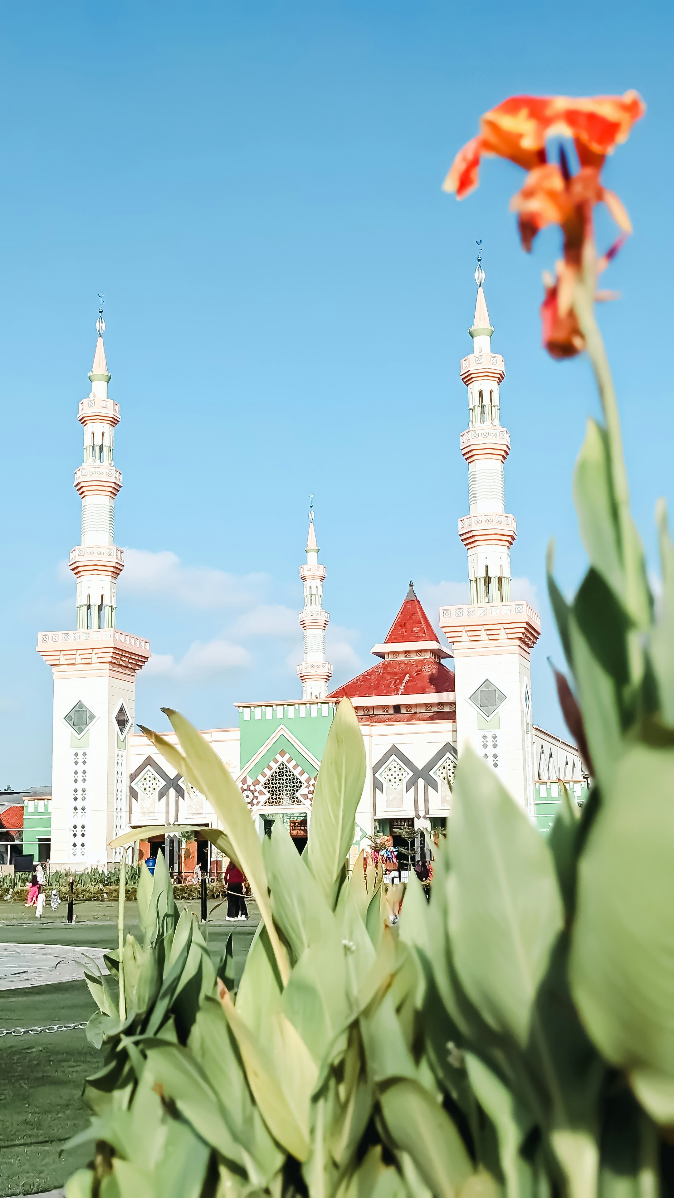 A beautiful mosque underneath a clear, blue sky.