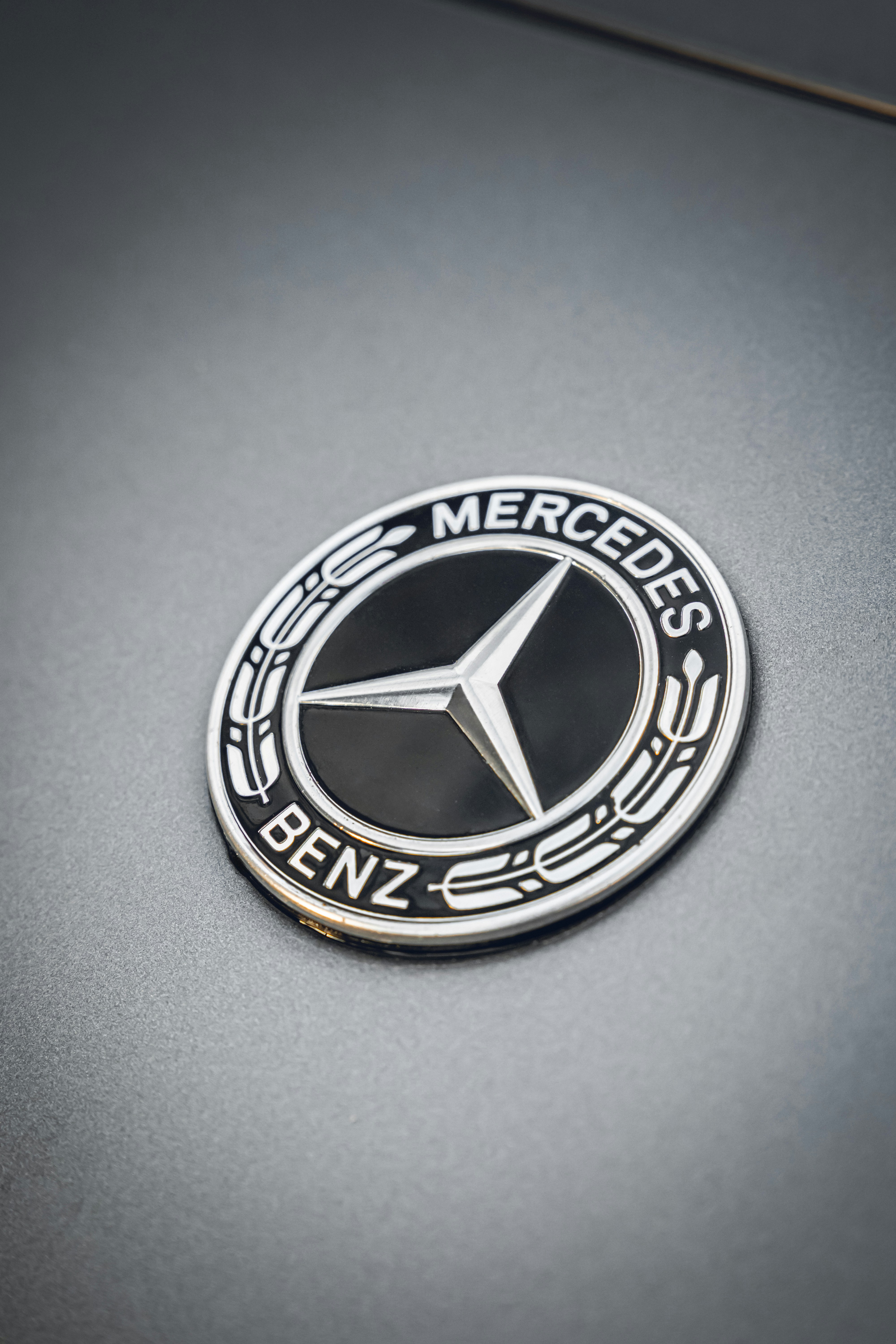 A close-up shot of the mercedes-benz logo.