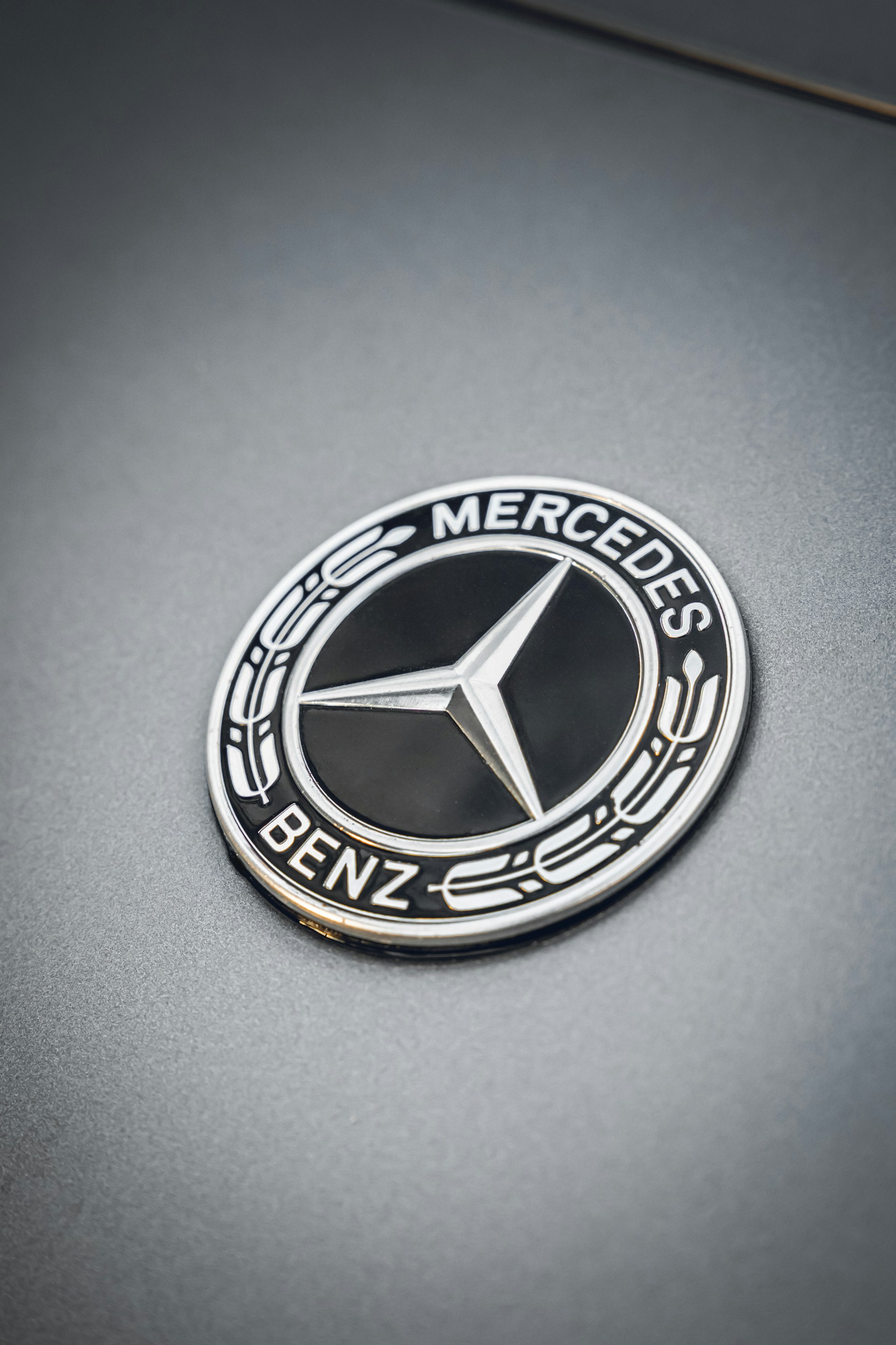A close-up shot of the mercedes-benz logo.