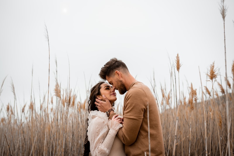 Loving couple embracing in field