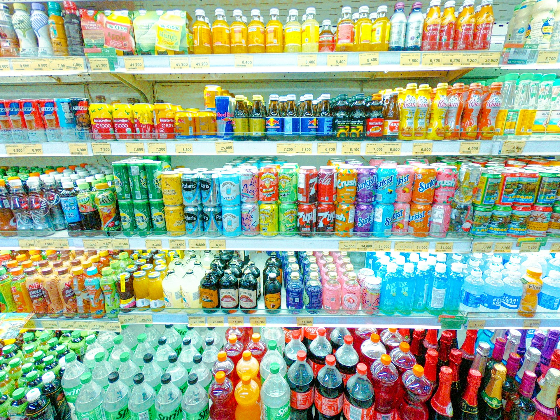 Shelves are stocked with a variety of drinks.