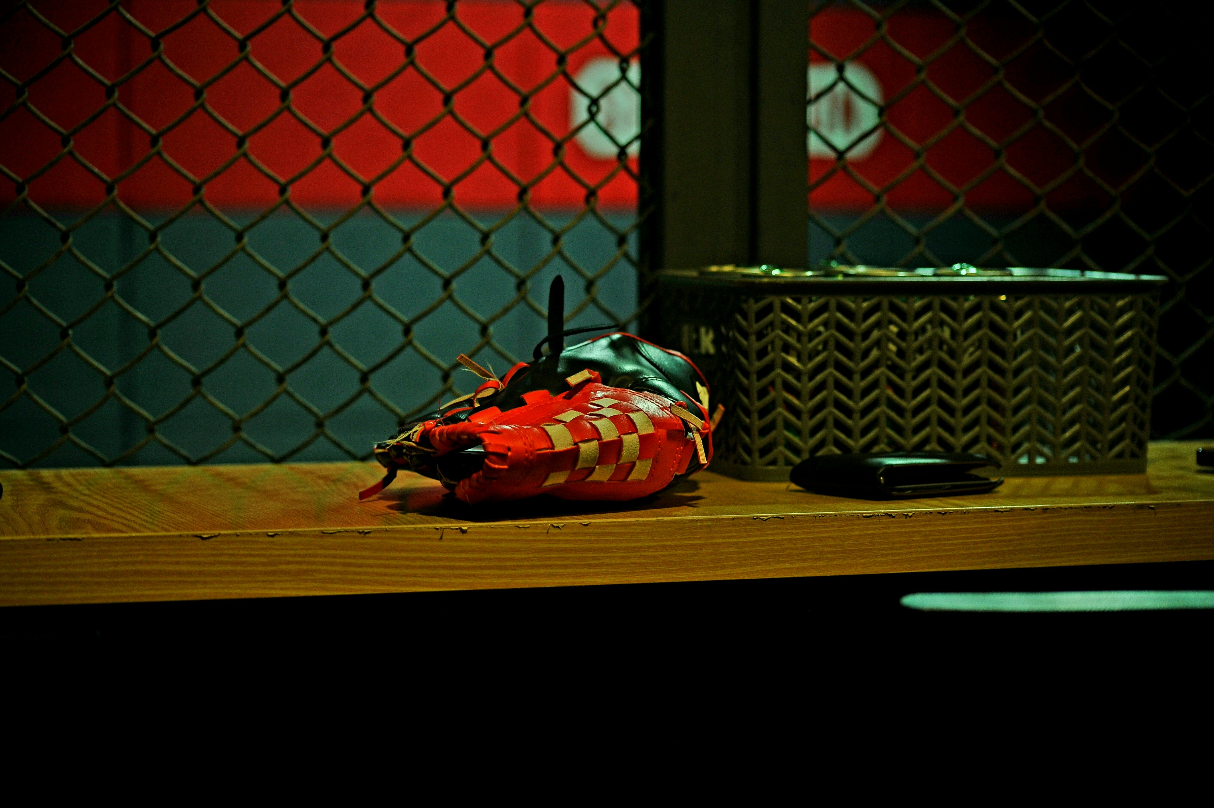 A damaged robot sits on a shelf.