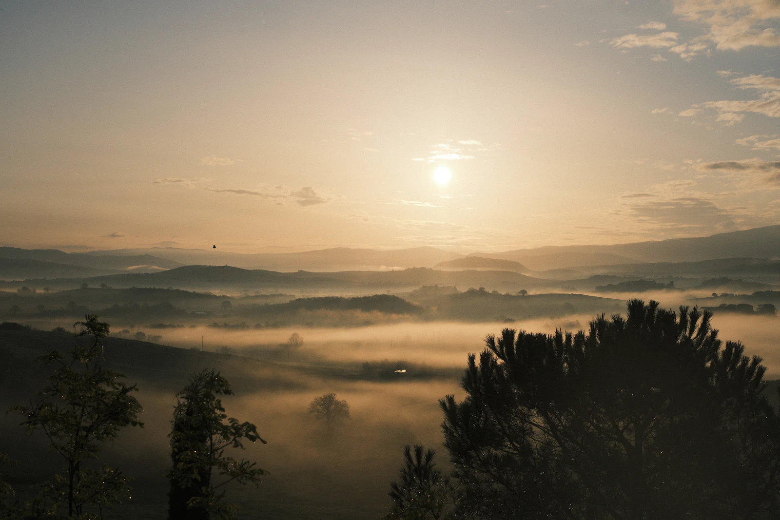 A misty sunrise over hills
