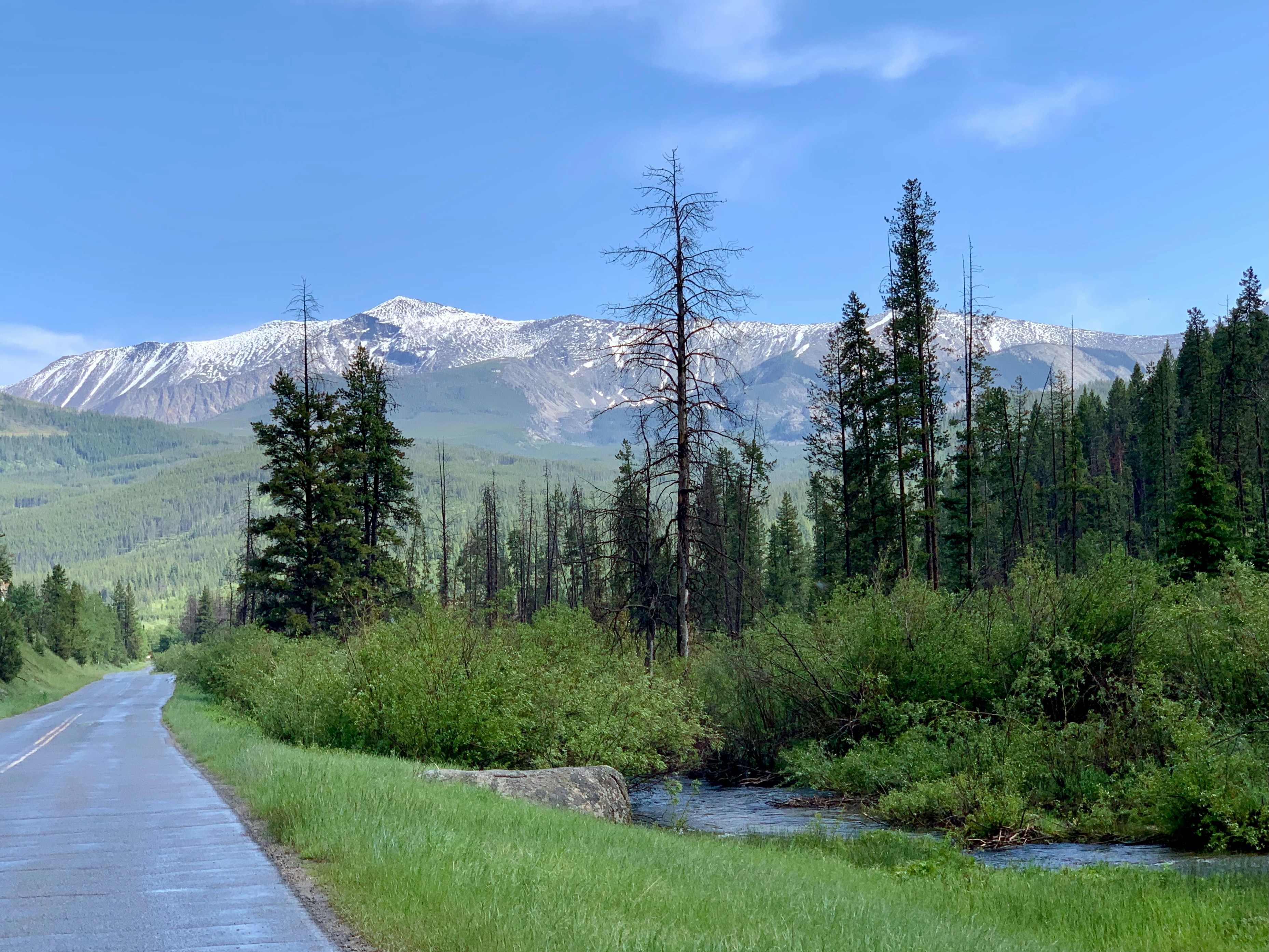 Road leads to a majestic mountain landscape.