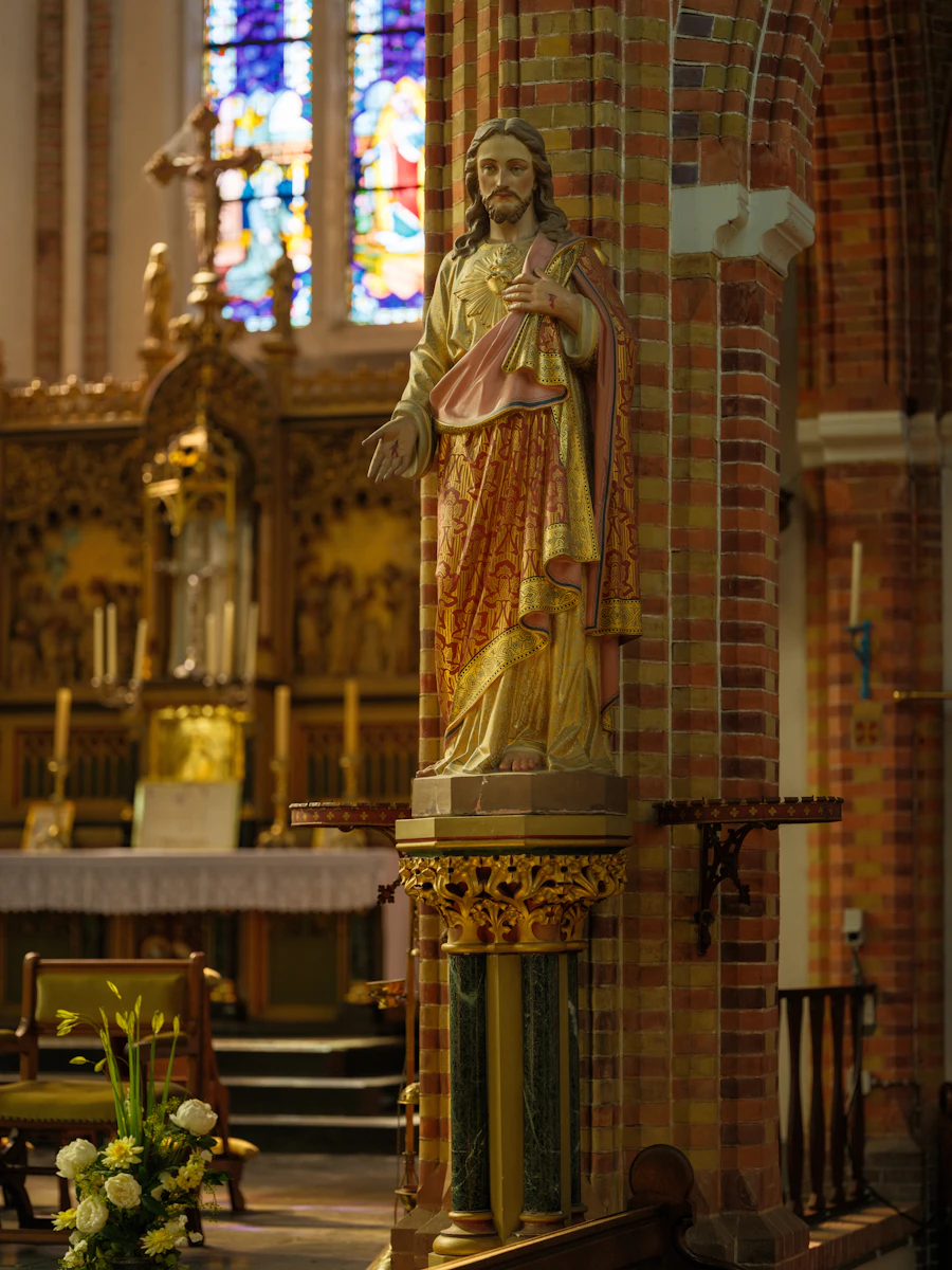 A statue of Jesus inside a beautiful church
