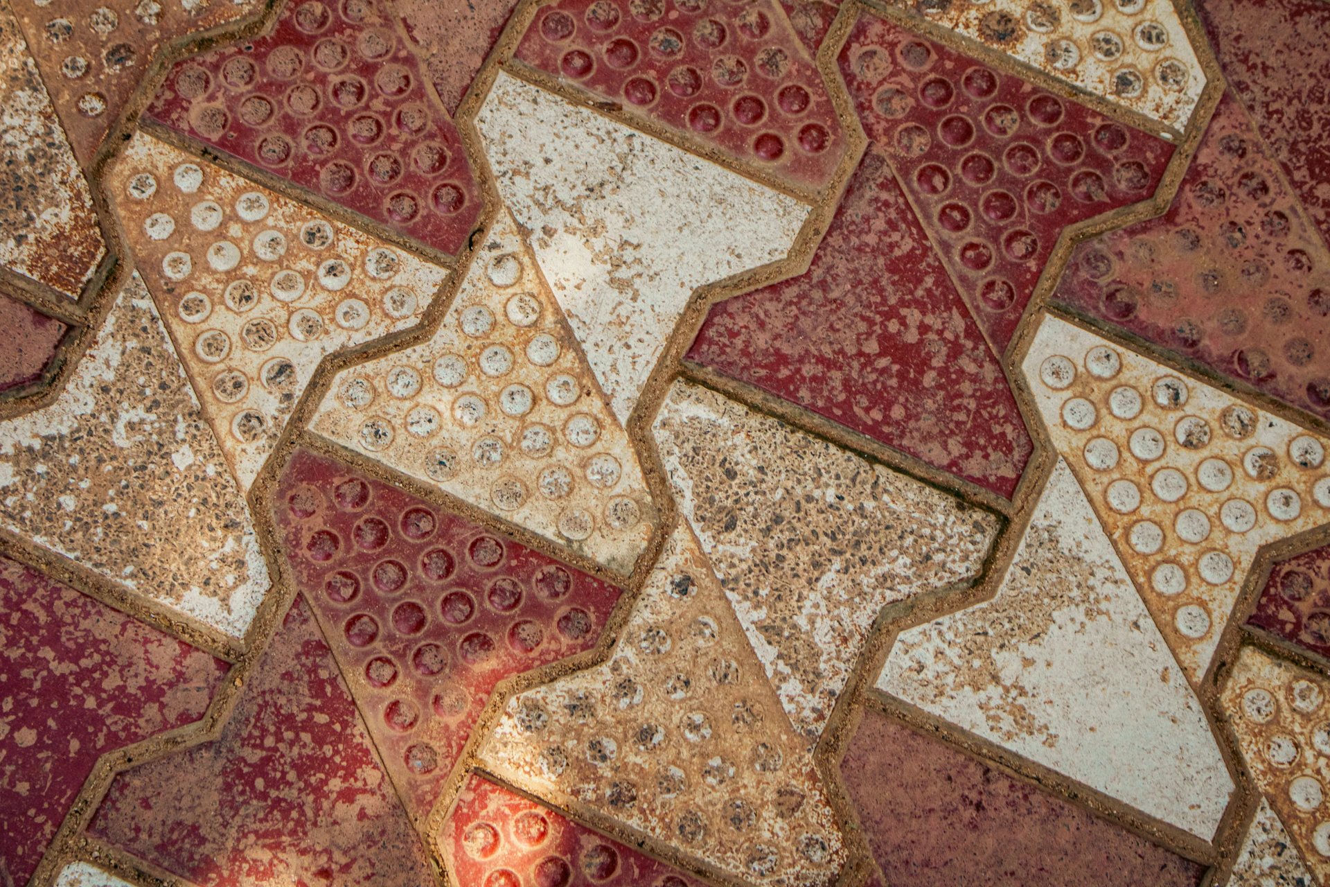 Geometric tile pattern with white and red.