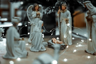 Nativity scene figurines illuminate the christmas season.