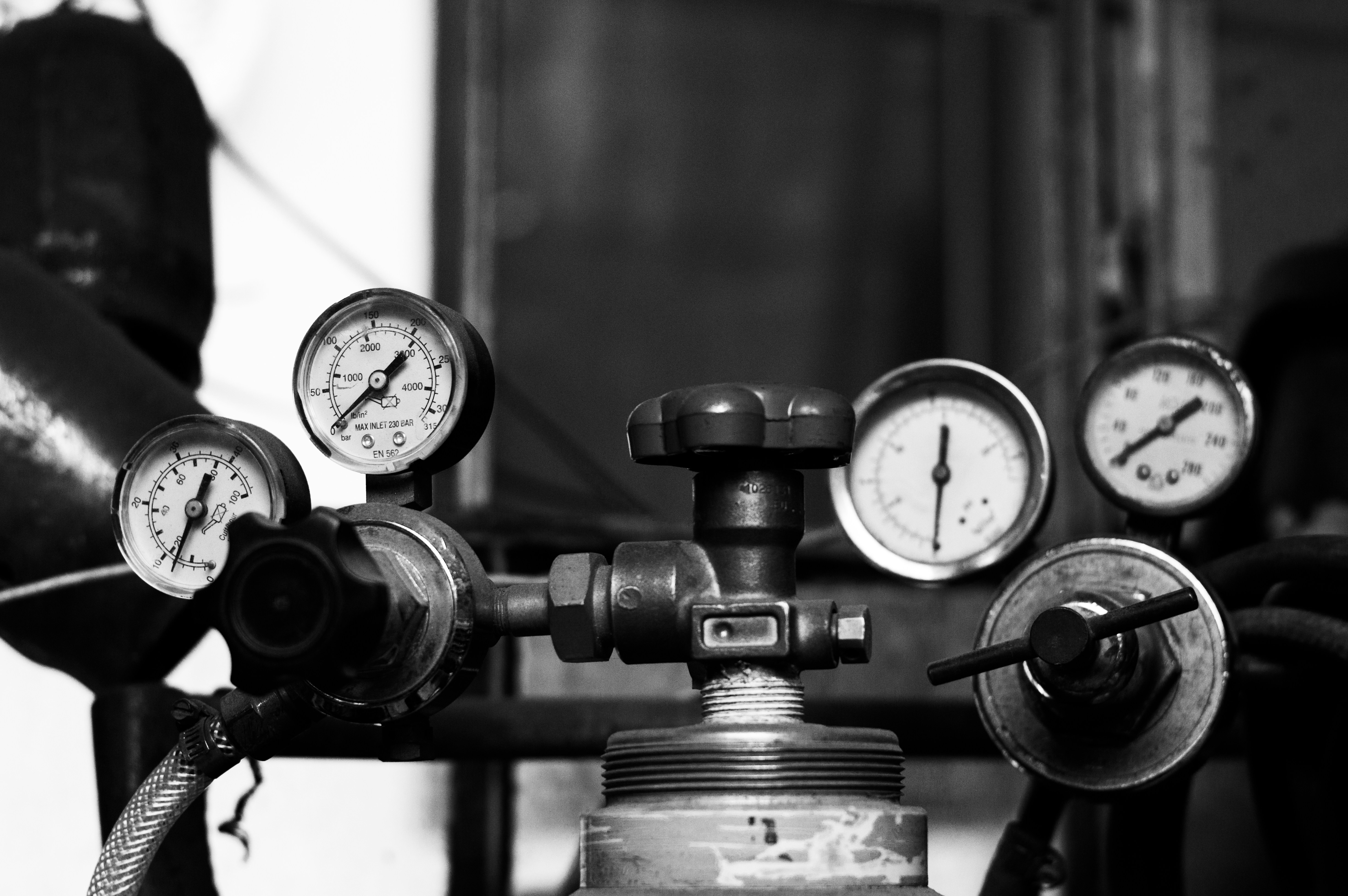 Pressure gauges and a valve are shown.