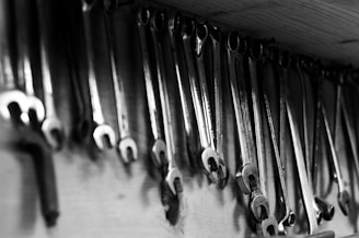 Wrenches hang neatly on a workshop wall.