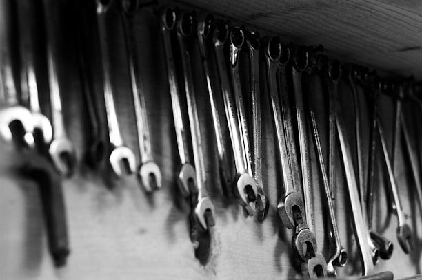 Wrenches hang neatly on a workshop wall.