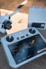 Drone controller and drone components displayed.
