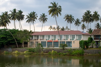 A building sits beside a body of water.