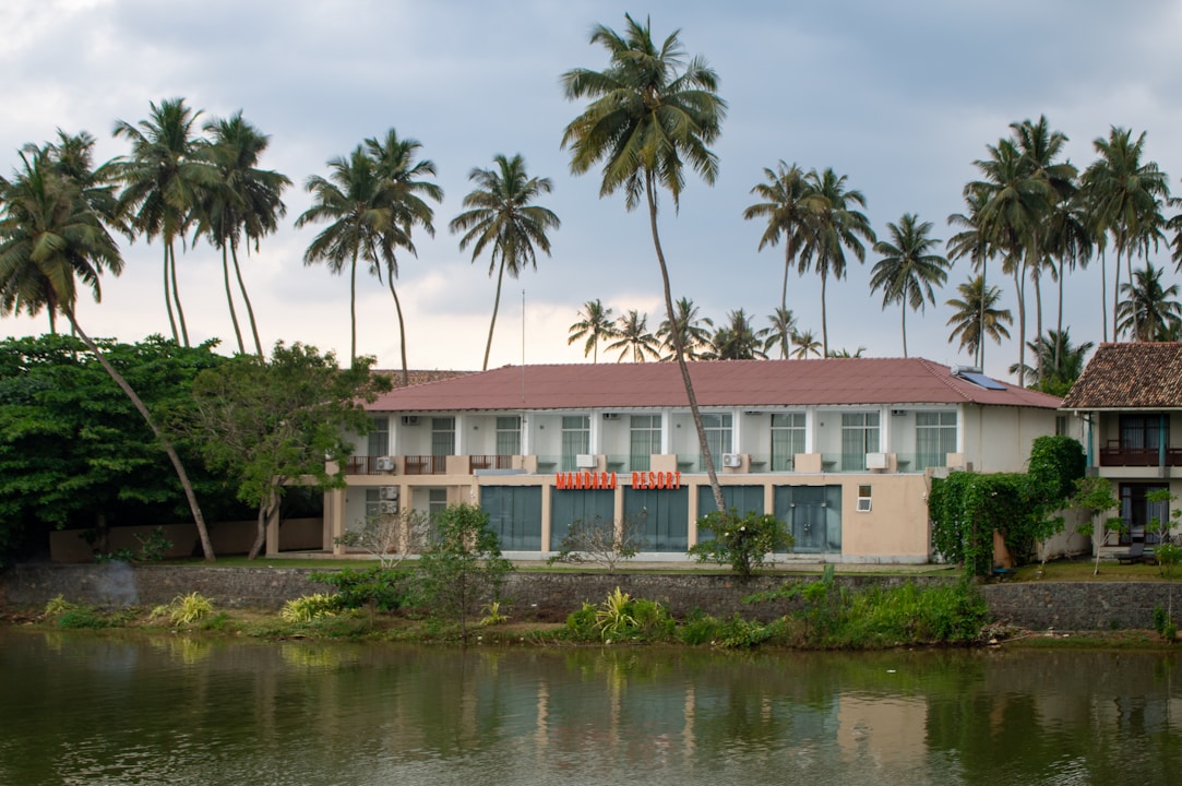 A building sits beside a body of water.