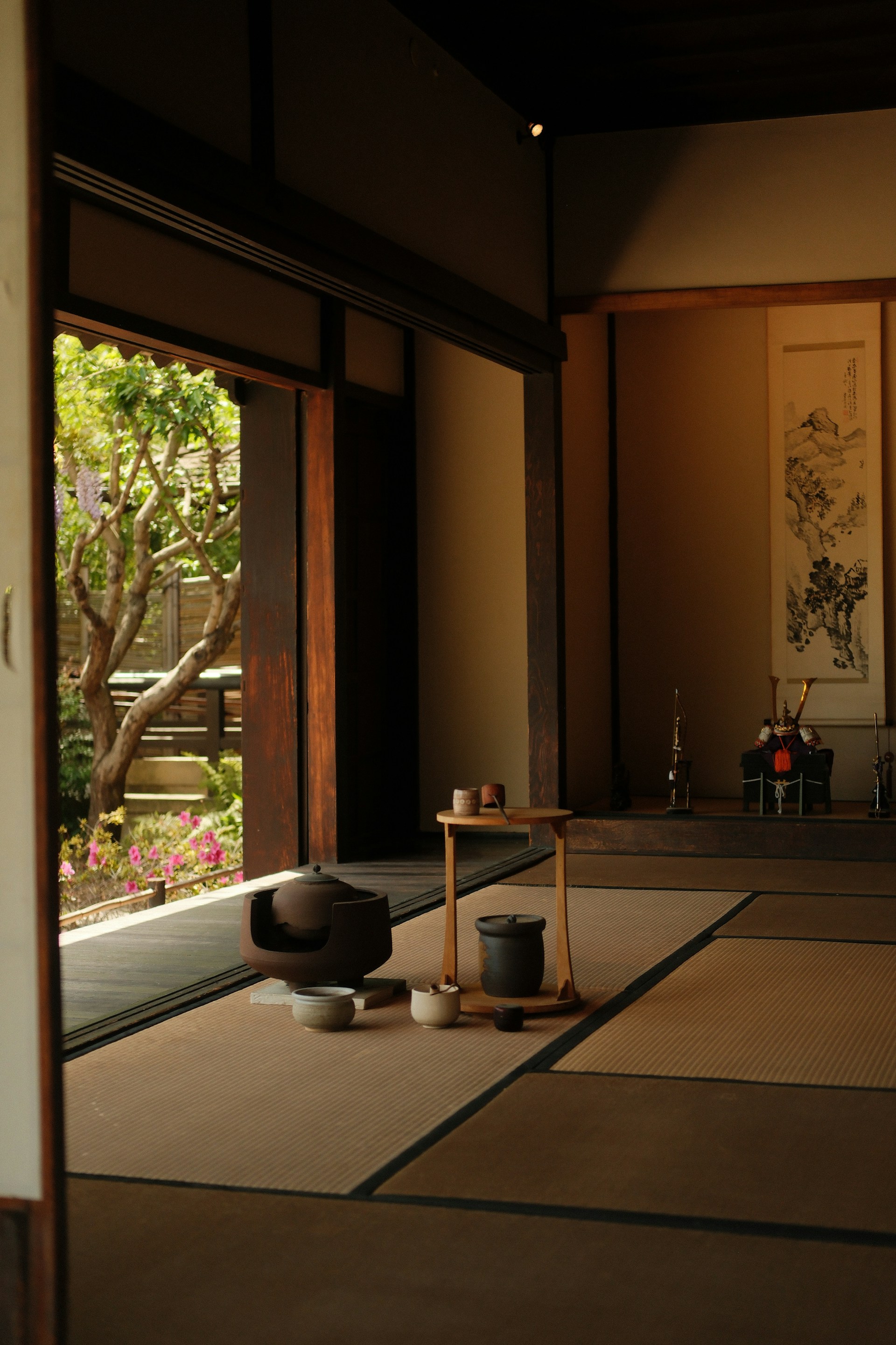 A serene japanese tea room with open doors.