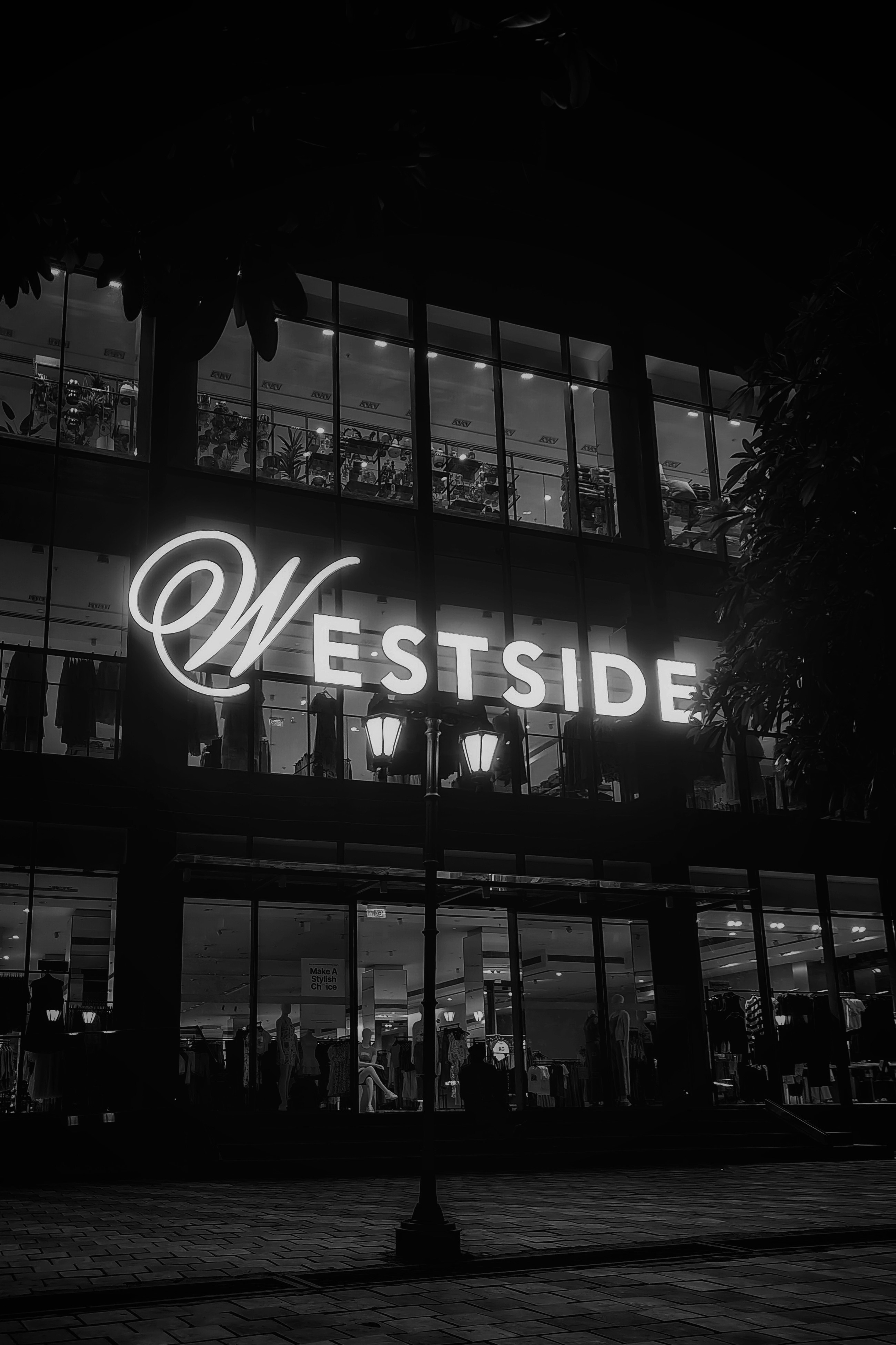 Westside is illuminated in neon at night.