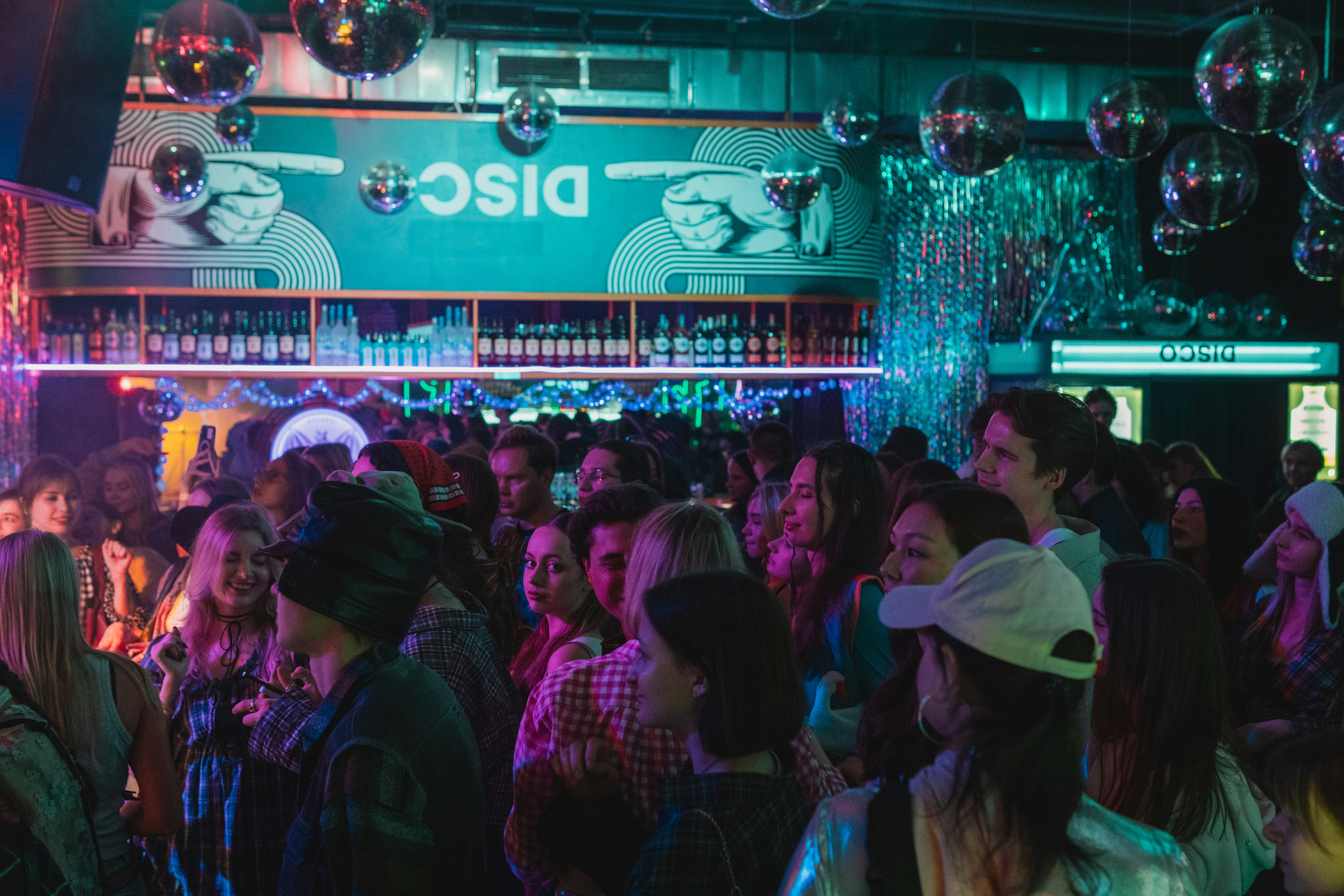 Crowded nightclub with flashing lights and people