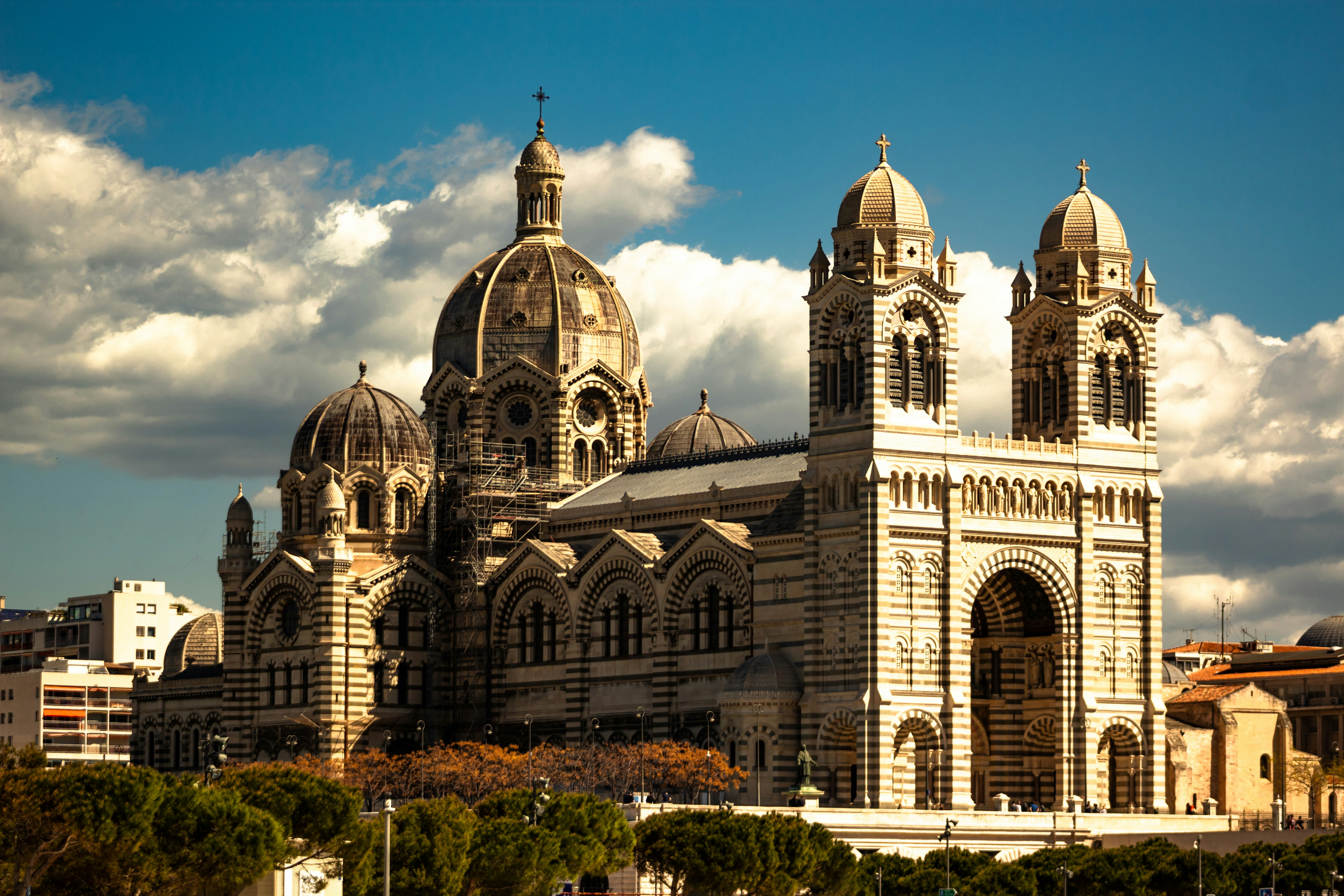 A stunning cathedral stands against a cloudy sky.