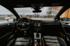 Interior view of a car with dashboard details.