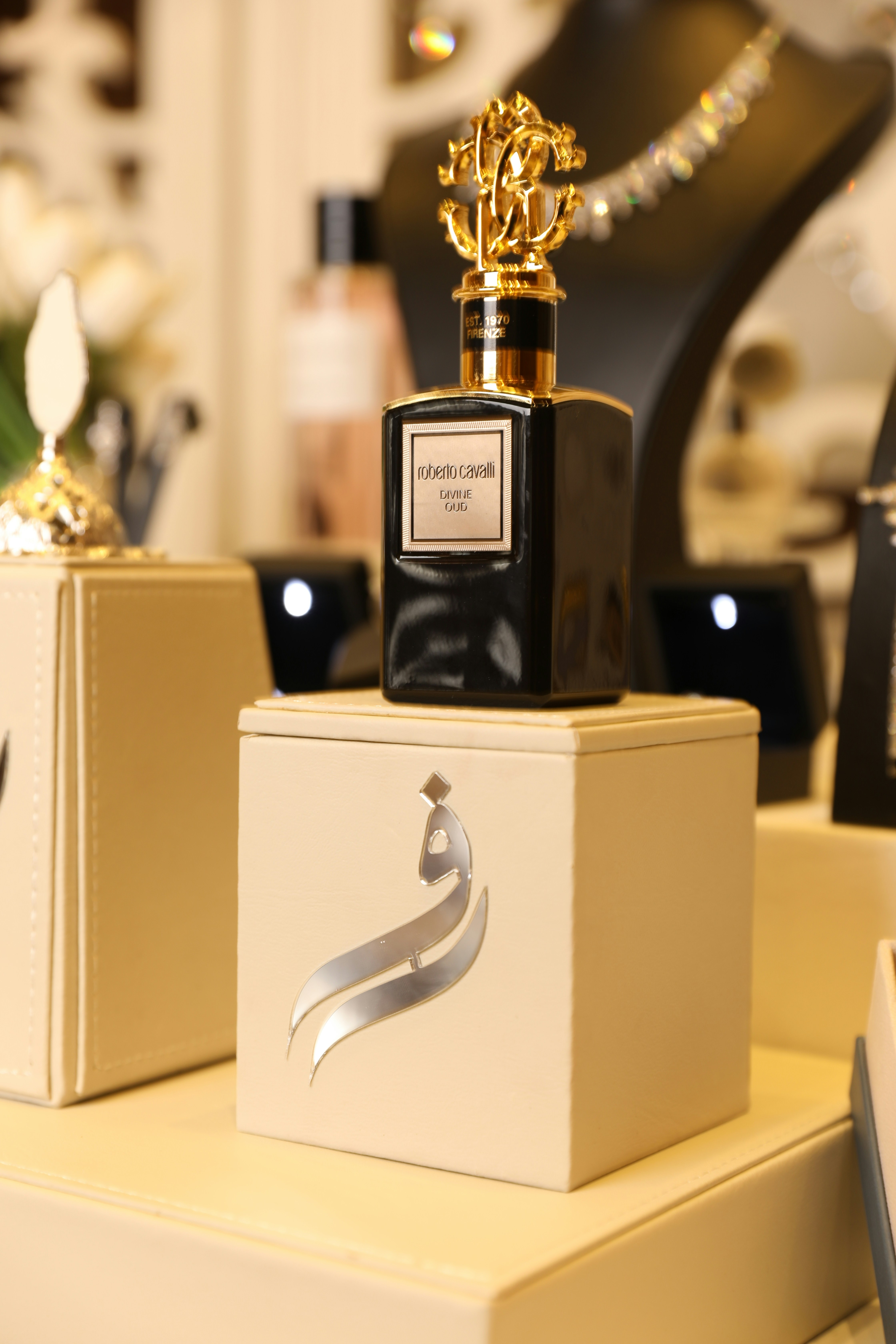 Luxurious perfume bottle elegantly displayed on a cube.